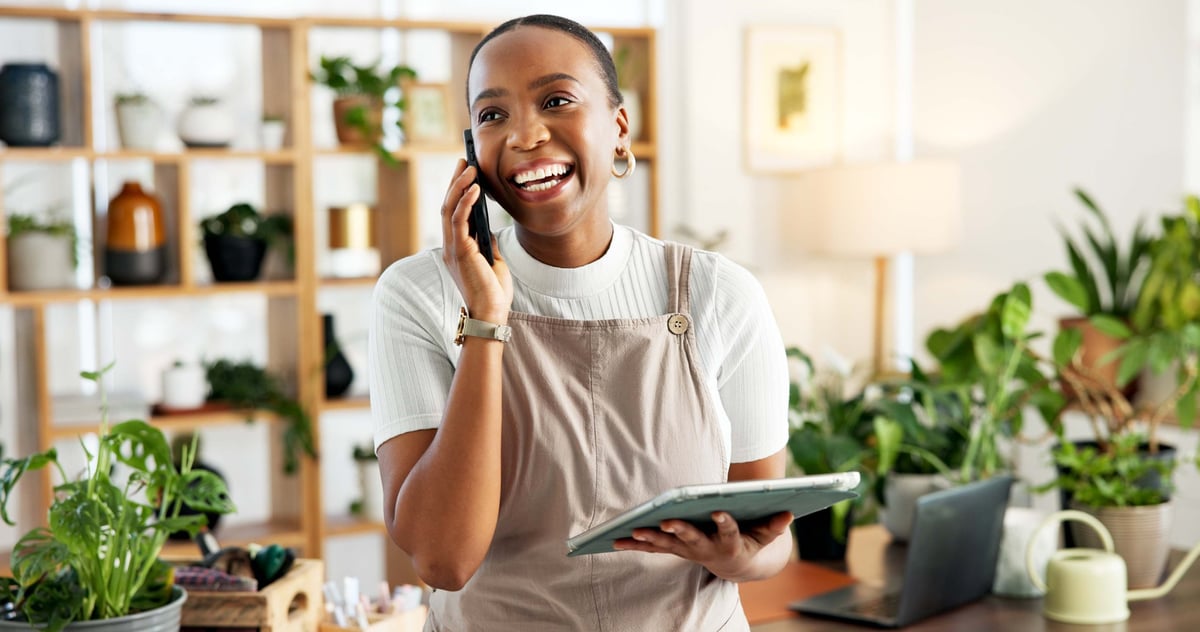 Phone call, tablet and thinking with black woman florist in office for online order confirmation.