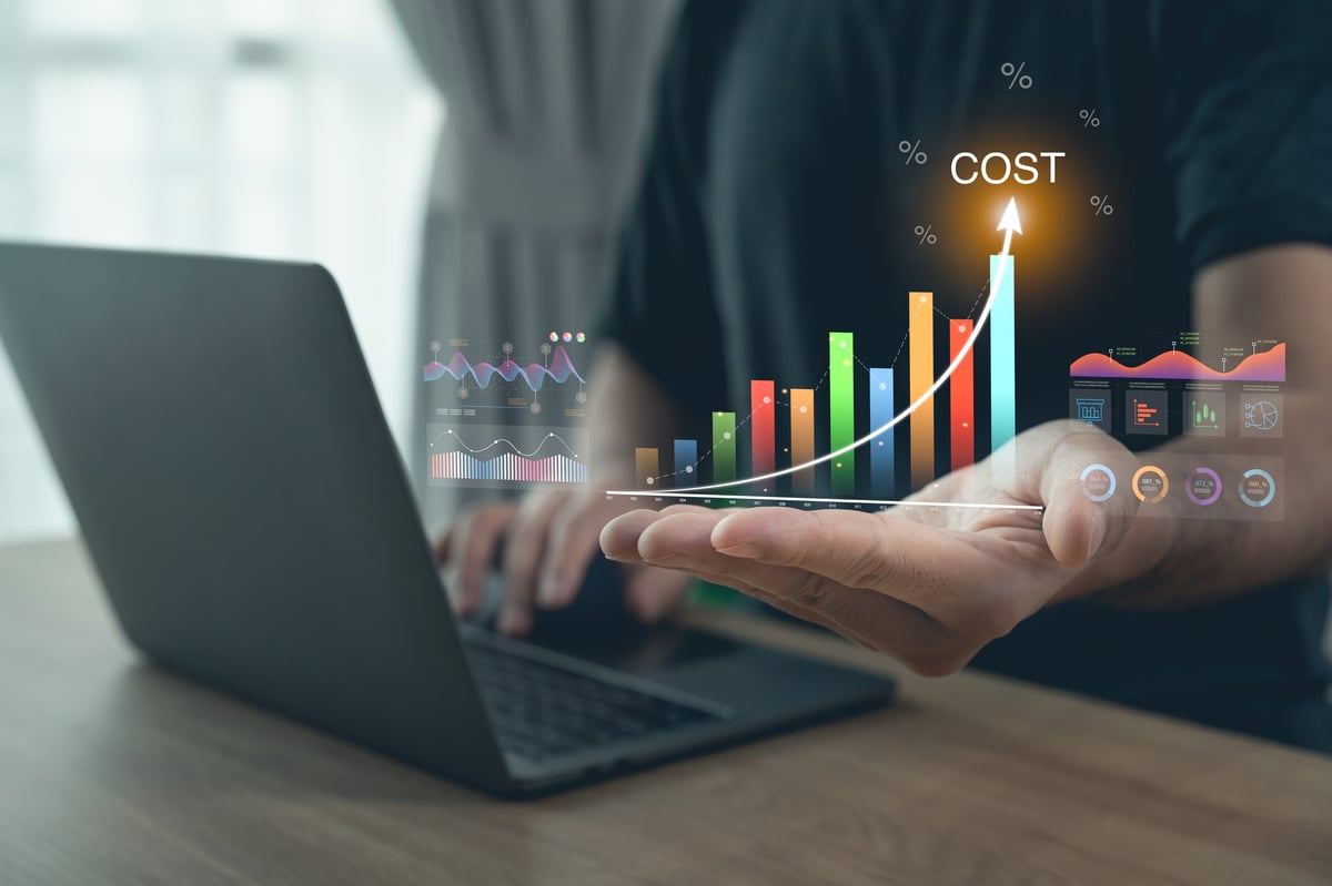 Business person interacting with data overlay and financial charts